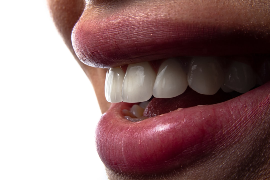 a close-up of a person's mouth with teeth showing