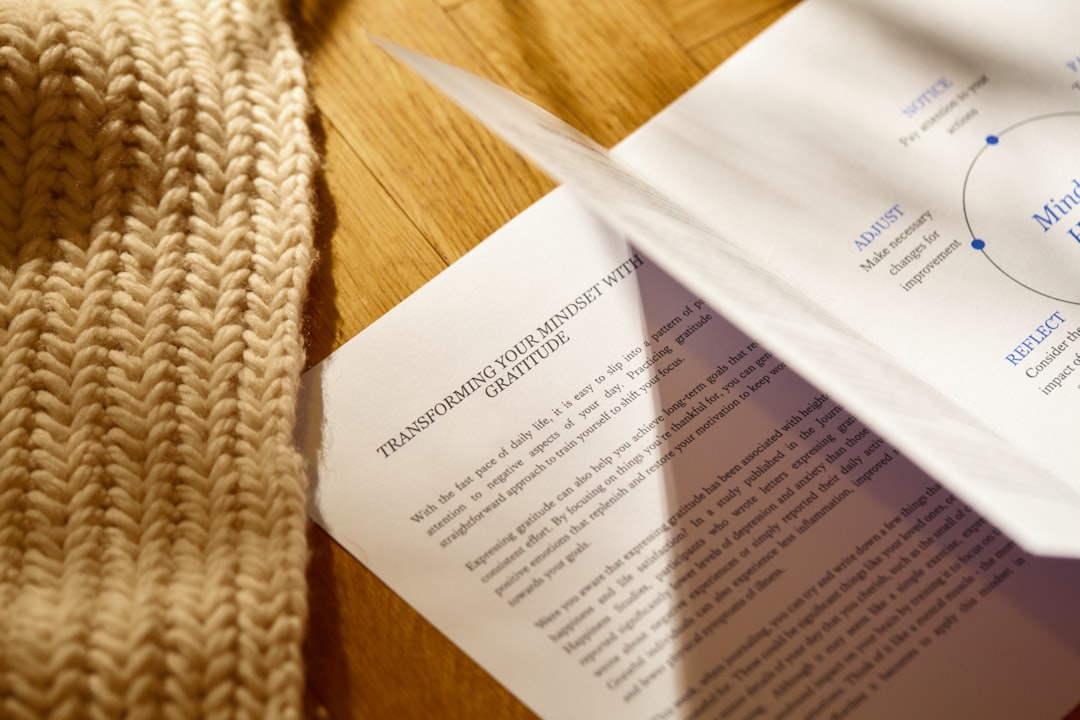 a pair of scissors laying on top of a piece of paper