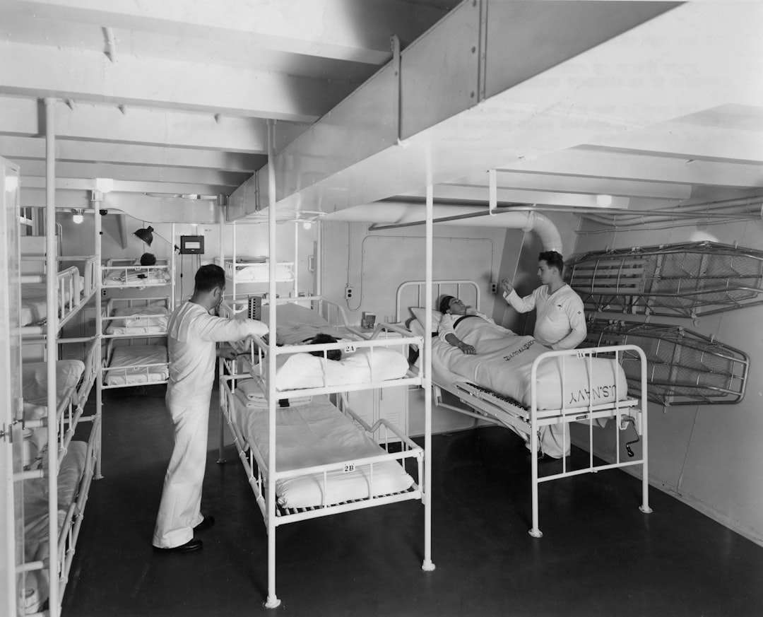 Medical ward with bunk beds and patients